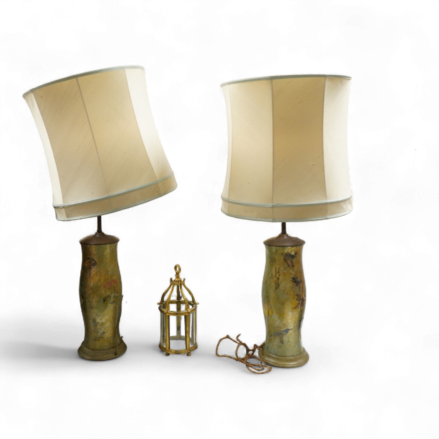 A pair of table lamps and shades, 92cm high, the lamps decorated in gold and green tones painted with birds and flowers, together with a small glass and brass hall lantern (3).